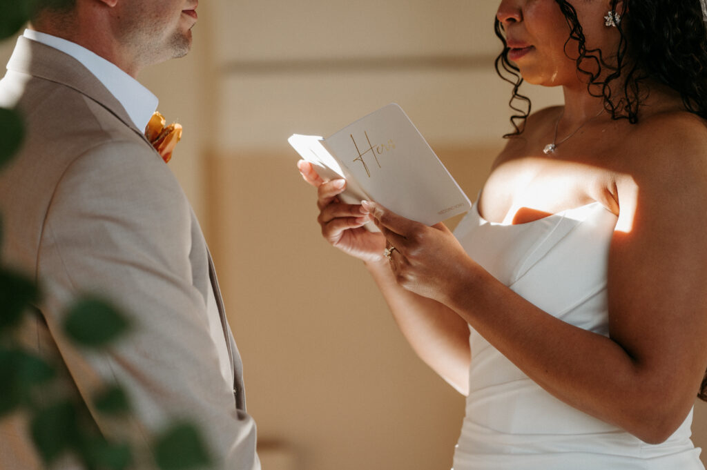 Bride reading vows during first look
