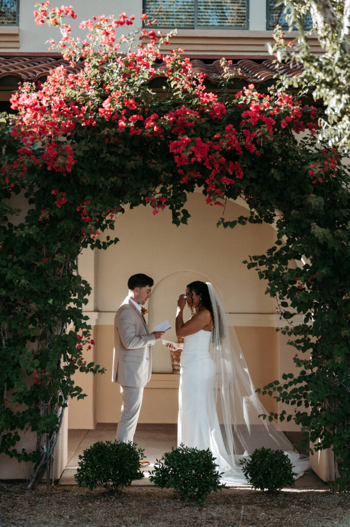 Bride and Groom reading vows at first look